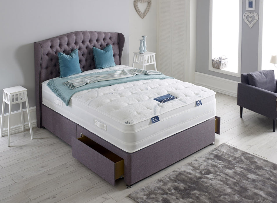 divan bed frame with two open drawers and air plus gel mattress